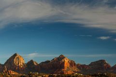 Sunset sky with wispy clouds above mountains and desert near Arabella Hotel Sedona in Sedona, AZ