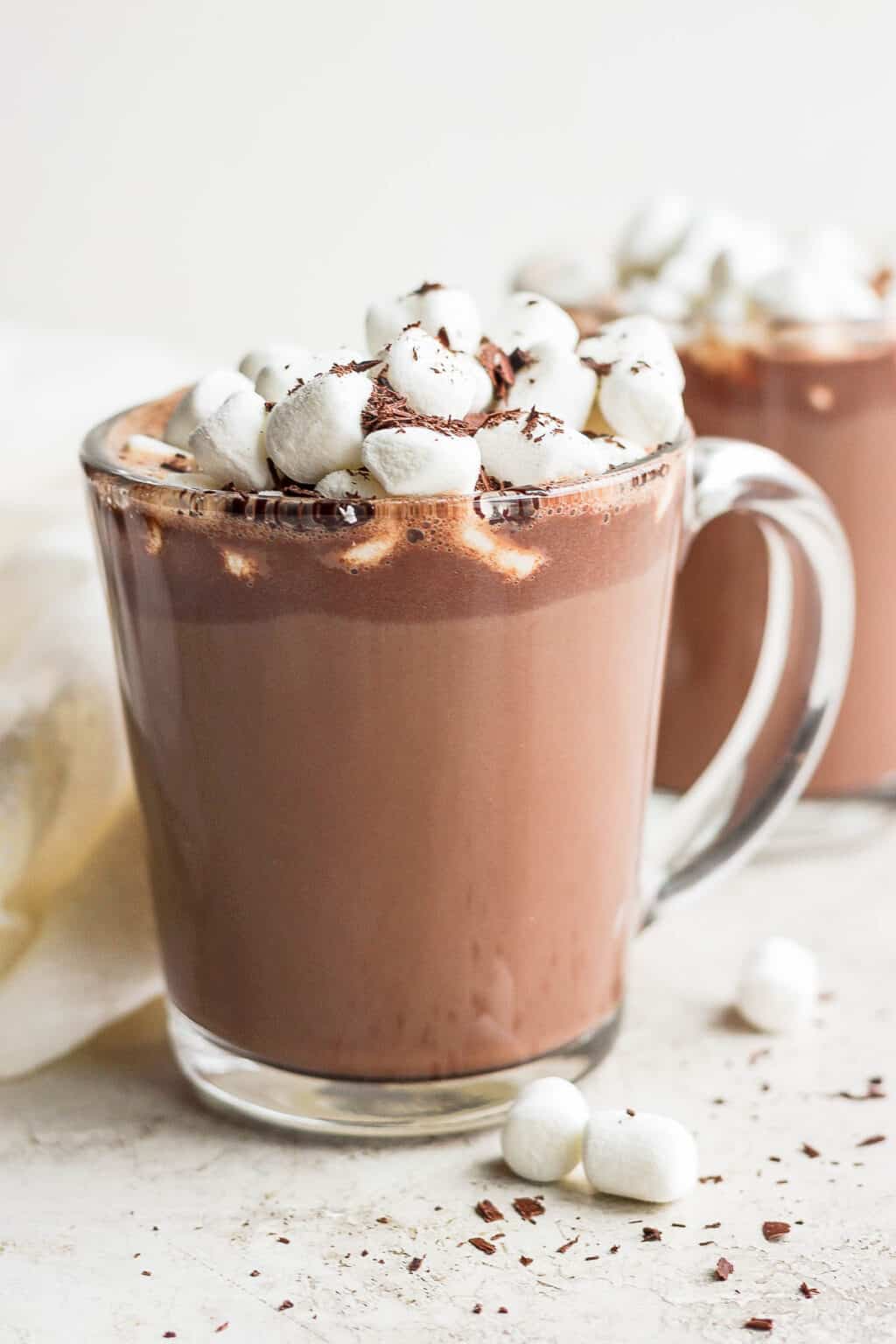 Glass mug of hot chocolate topped with marshmallows and chocolate shavings at Arabella Sedona.
