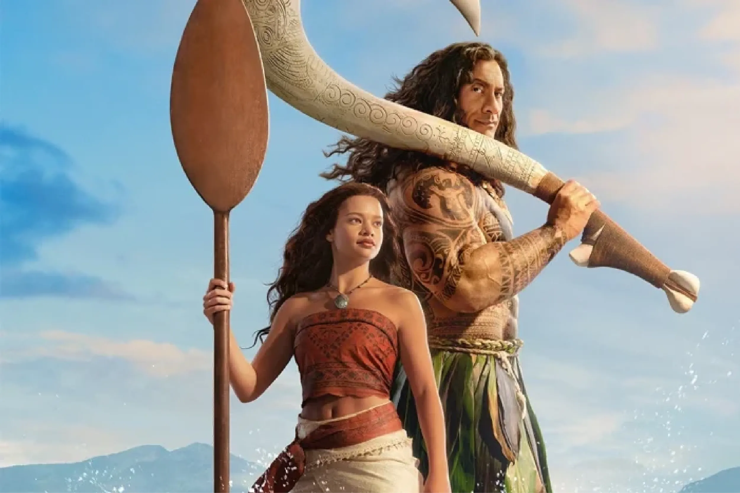 Moana with a wooden paddle and Maui with a fishhook at Arabella Sedona, standing before a blue sky and water.