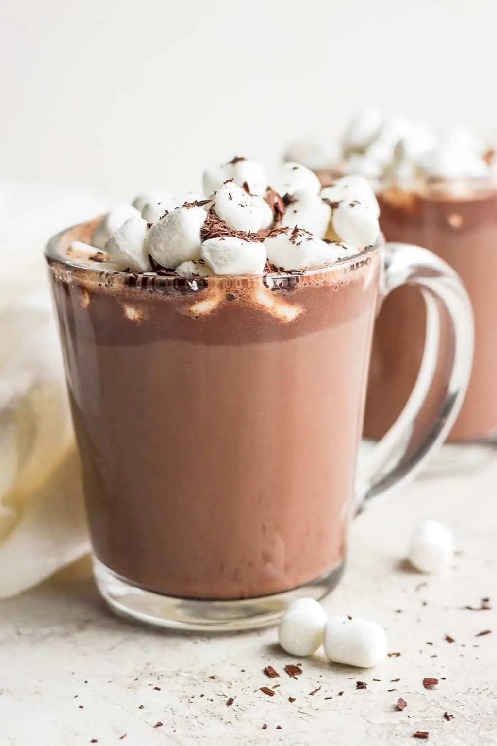 Glass mug of hot chocolate topped with marshmallows and chocolate shavings at Arabella Sedona.